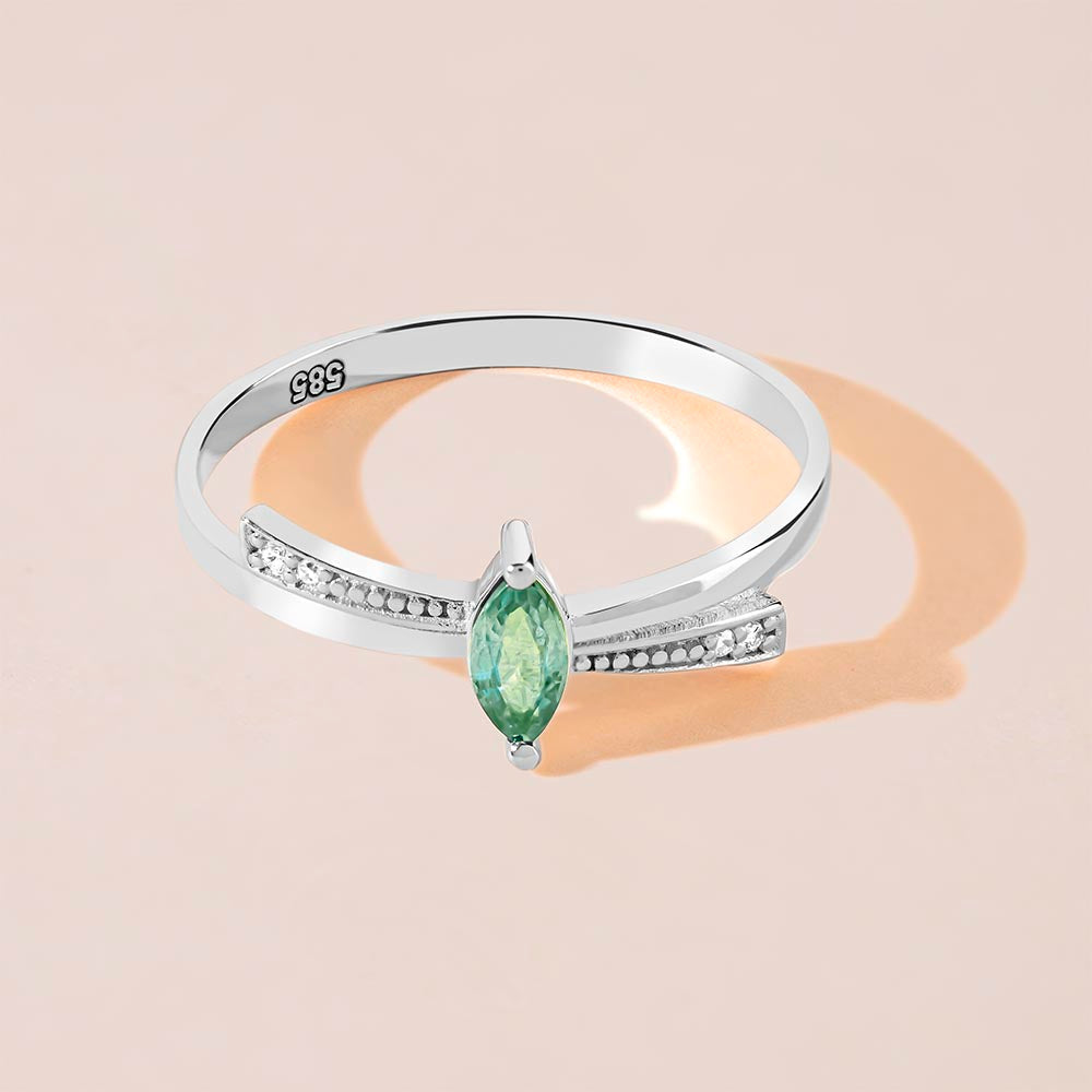 Marquise cut diamond emerald ring