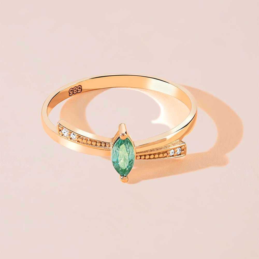 Marquise cut diamond emerald ring